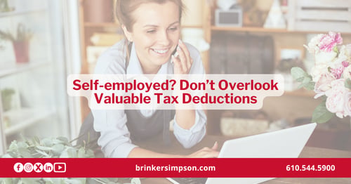 Self-employed professional reviewing business expense receipts for tax deductions